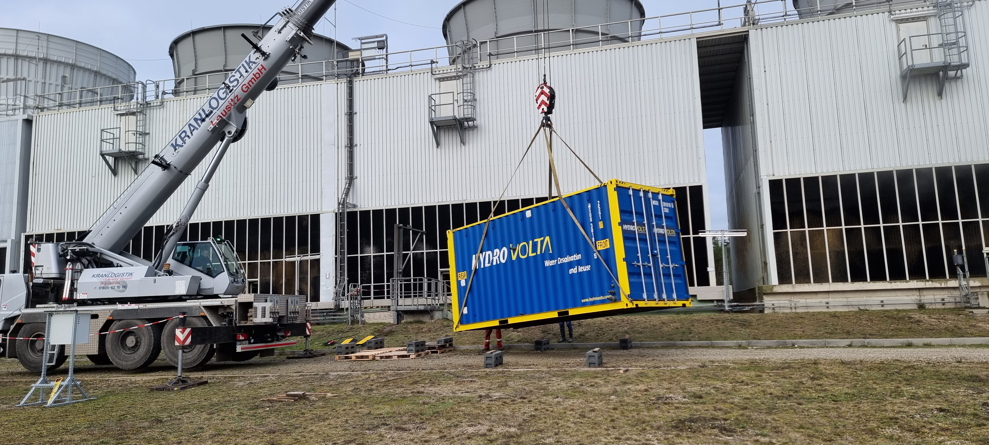 Hydrovolta SalinBloc container being deployed on-site by crane
