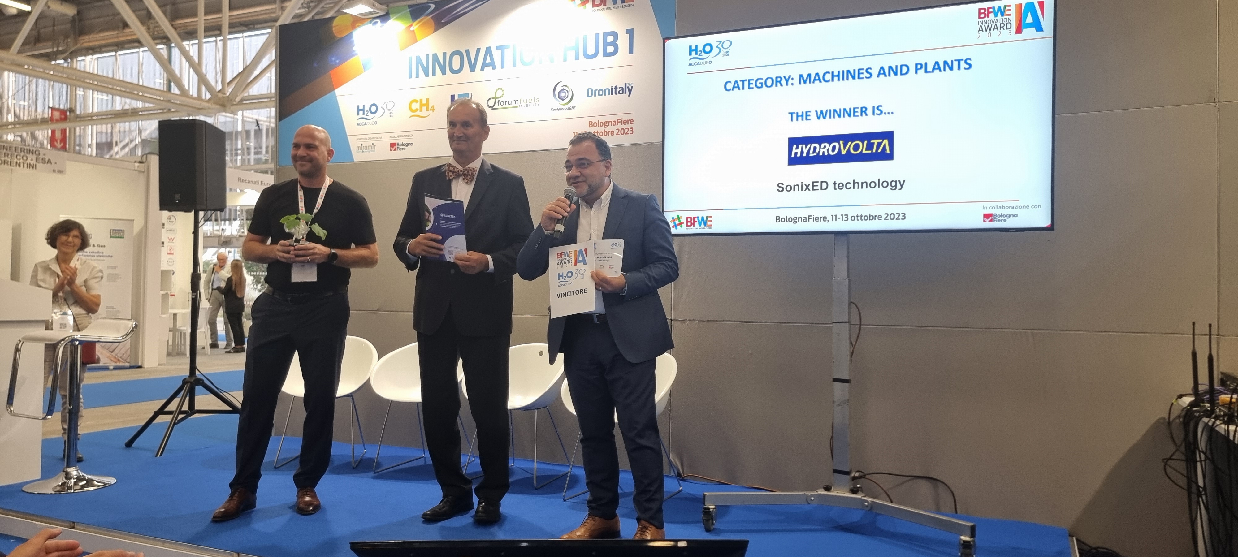 George Brik receiving BFW Innovation Award 2023 for SonixED technology at BolognaFiere
